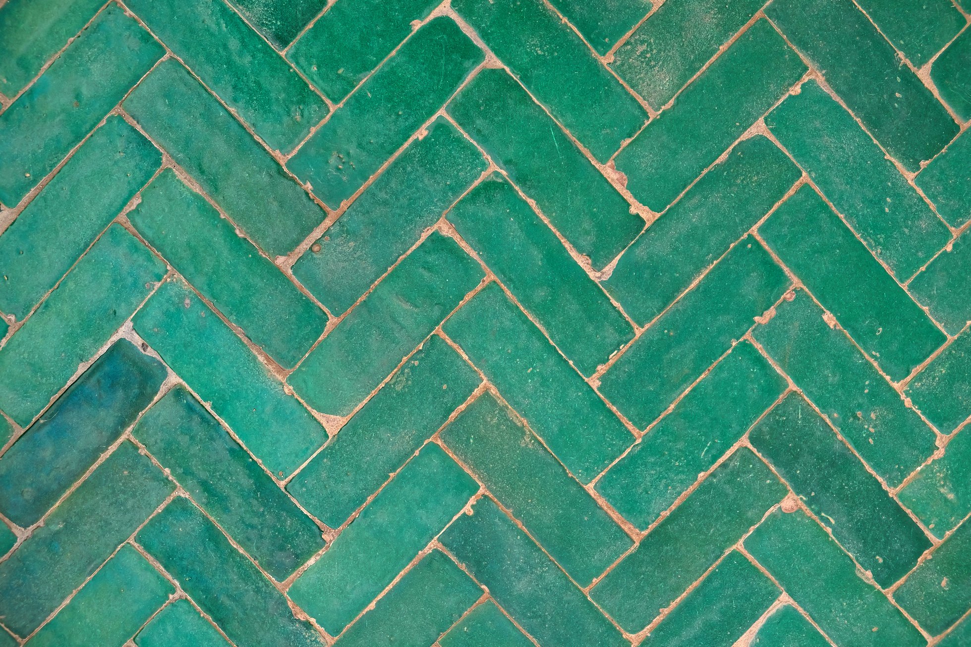 Herringbone green ceramic floor tile